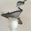 Thumbnail: Black and White -Ascot spiral hat in black and white sinamay on a white button