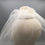 Thumbnail: Roberta - White lace and silk button headpiece with a shoulder length veil