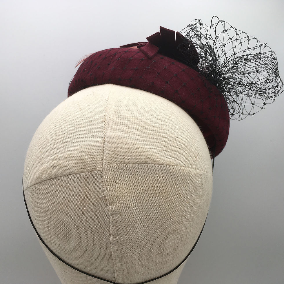 Thumbnail: Edith - Burgundy wool felt button measuring with black veiling, felt and feather