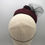Thumbnail: Edith - Burgundy wool felt button measuring with black veiling, felt and feather
