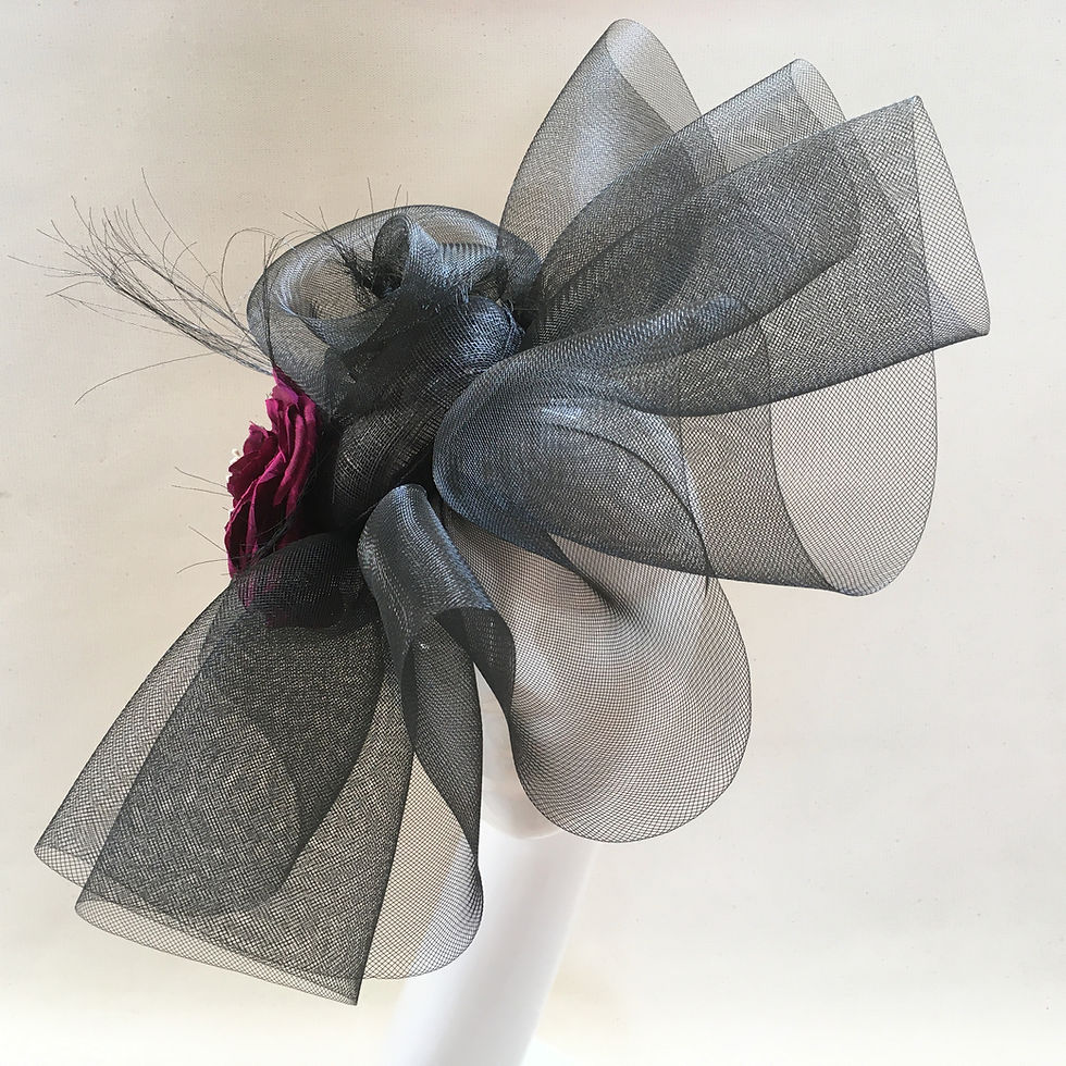 Thumbnail: Valerie - Black crinoline headpiece with a sinamay base and camillia