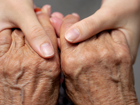 Holding an elderly person's hands
