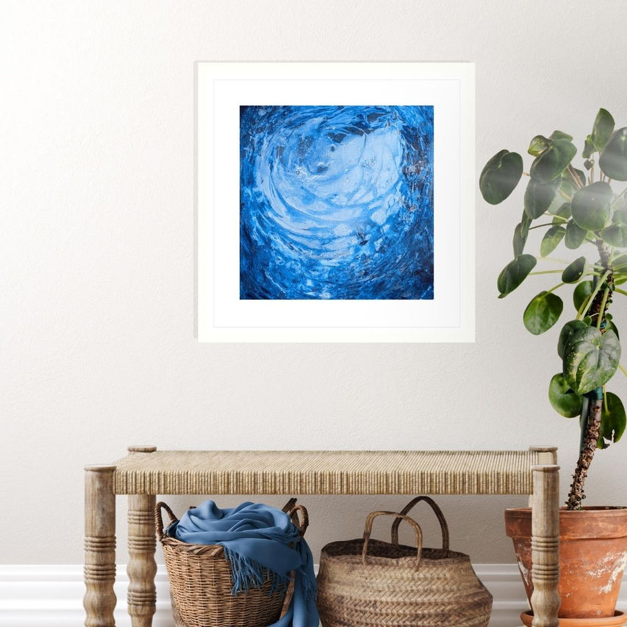 Blue abstract artwork above a wooden bench