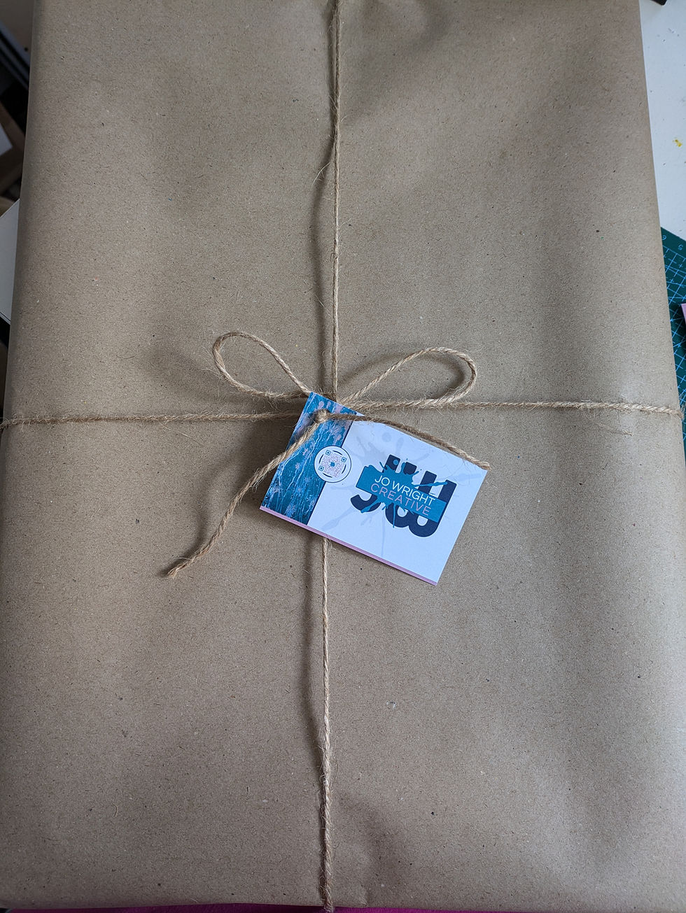Brown paper package with twine and a gift tag