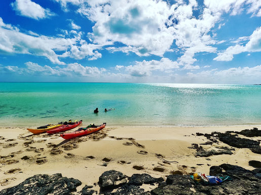 Kayakers taking a swim break in the Bahamas.