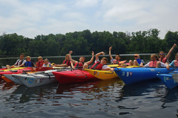 Happy group of young kayakers.
