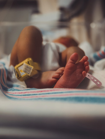 baby lying on bed_edited.jpg