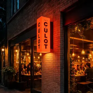 Custom light box sign reading CULOT outside a restaurant