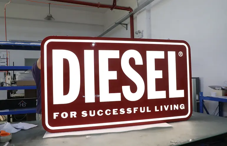 Custom light box featuring the Diesel brand logo.