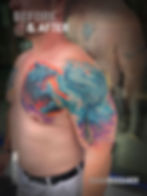 Close-up view of colorful tattoo designs on a wall