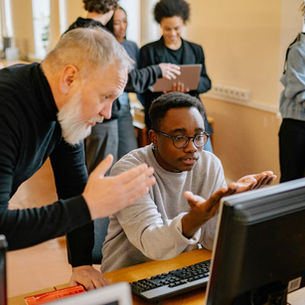 Dad and son working on computer