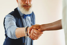 stylish-man-and-african-woman-handshake-2023-11-27-04-55-47-utc.jpg