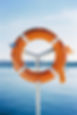 red-lifebuoy-on-a-metal-rack-on-the-pier-close-up-2023-11-27-05-21-20-utc.jpg