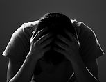 sad-and-depressed-man-covering-face-feeling-depr-2023-11-27-05-36-21-utc.jpg
