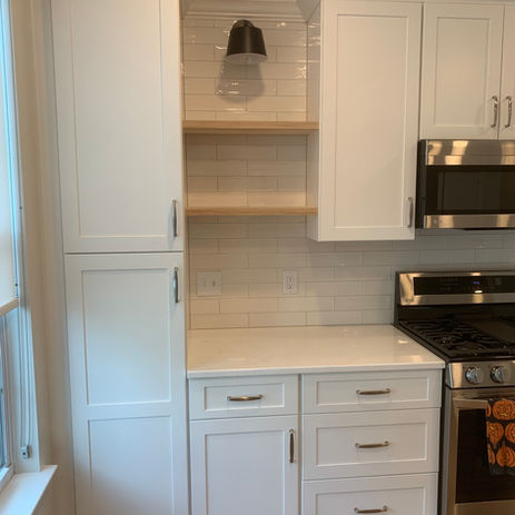 Custom white kitchen cabinetry with quartz countertops, subway tile backsplash, and stainless appliances by Booth Home Impressions in South Jersey