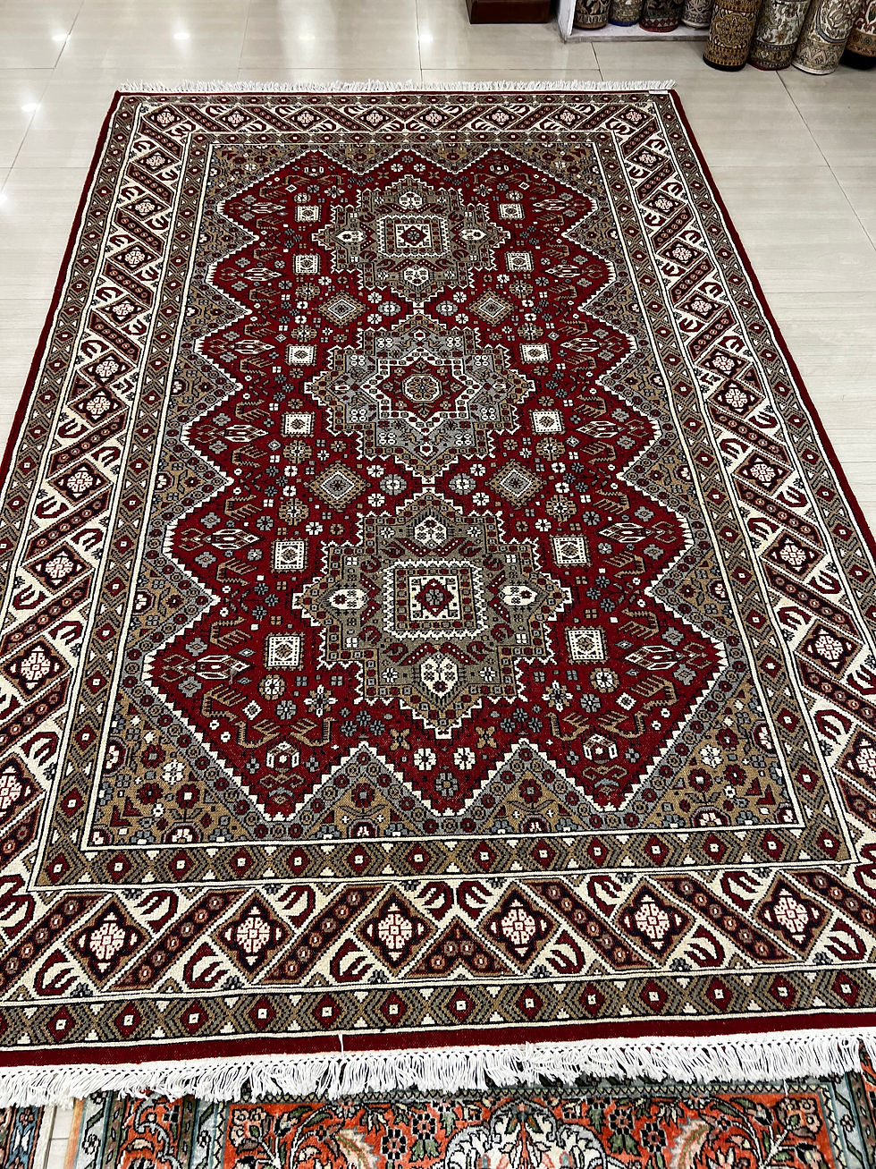 2 metre by 3 metre wool and silk carpet in red cream tones 300 knots per square inch 