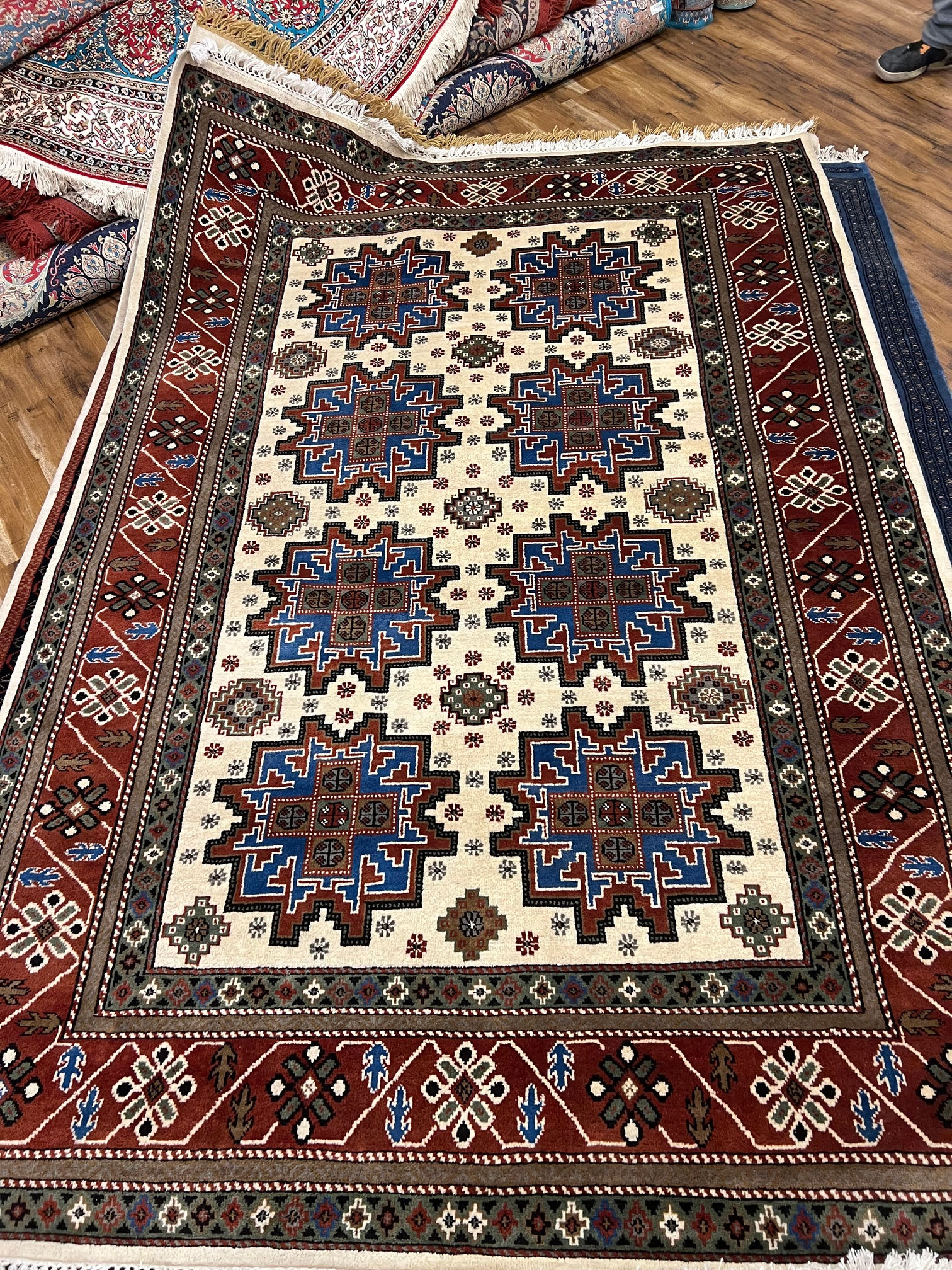 2 metre by 3 metre wool and silk carpet in red pattern cream tones 250 knots per square inch