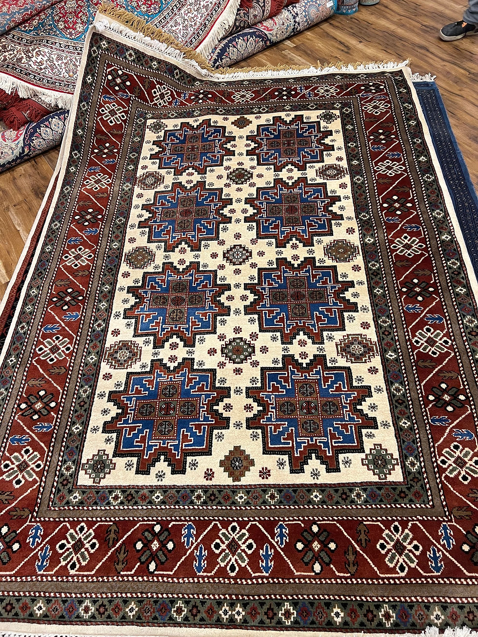 2 metre by 3 metre wool and silk carpet in red pattern cream tones 250 knots per square inch 