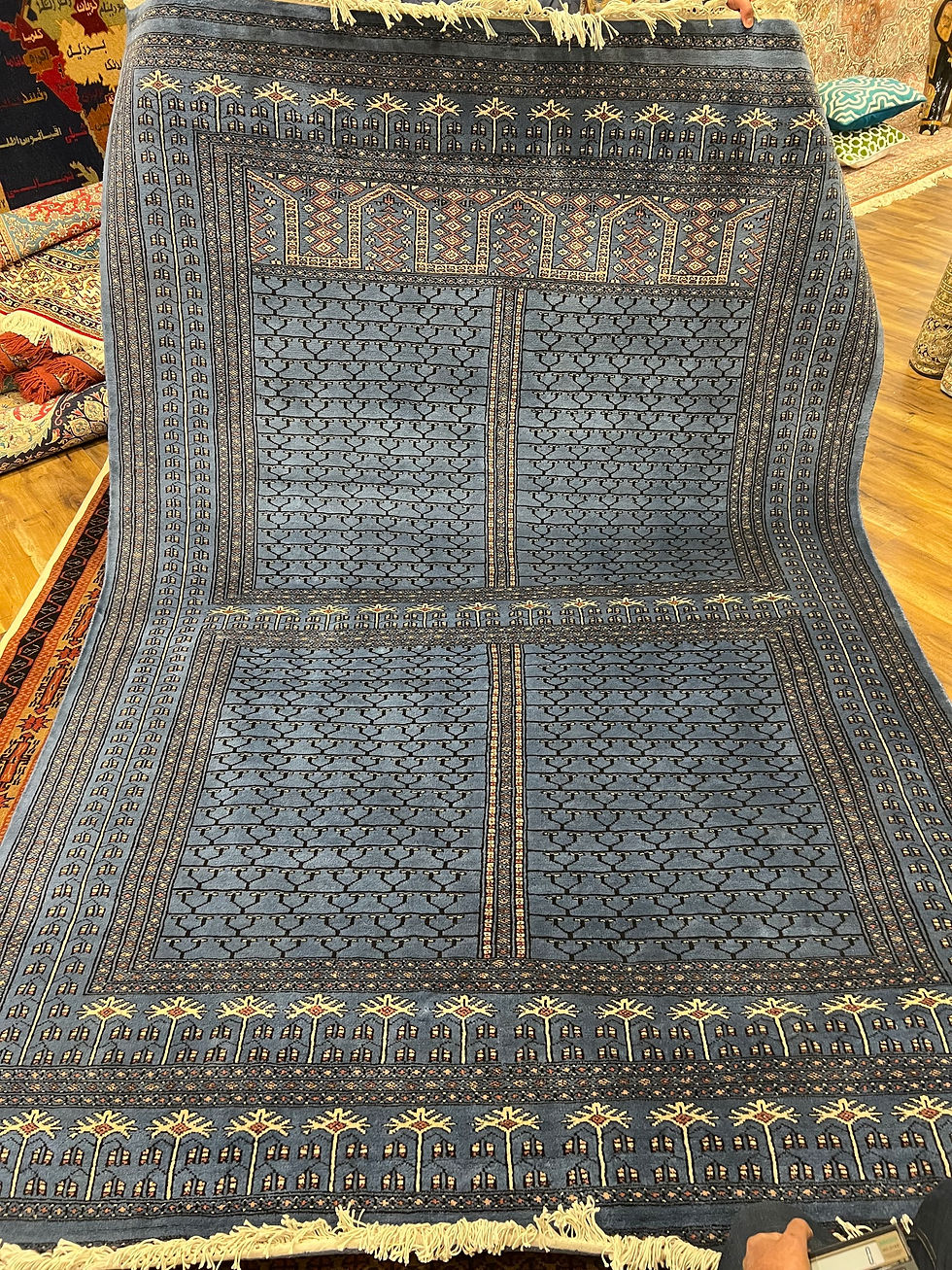 2 metre by 3 metre wool and silk carpet in Prussian blue and cream tones 300 knots per square inch