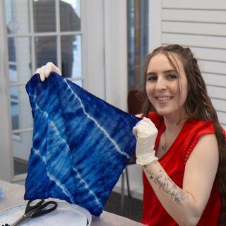 Marley Heidel holding a finished indigo-dyed bandana.