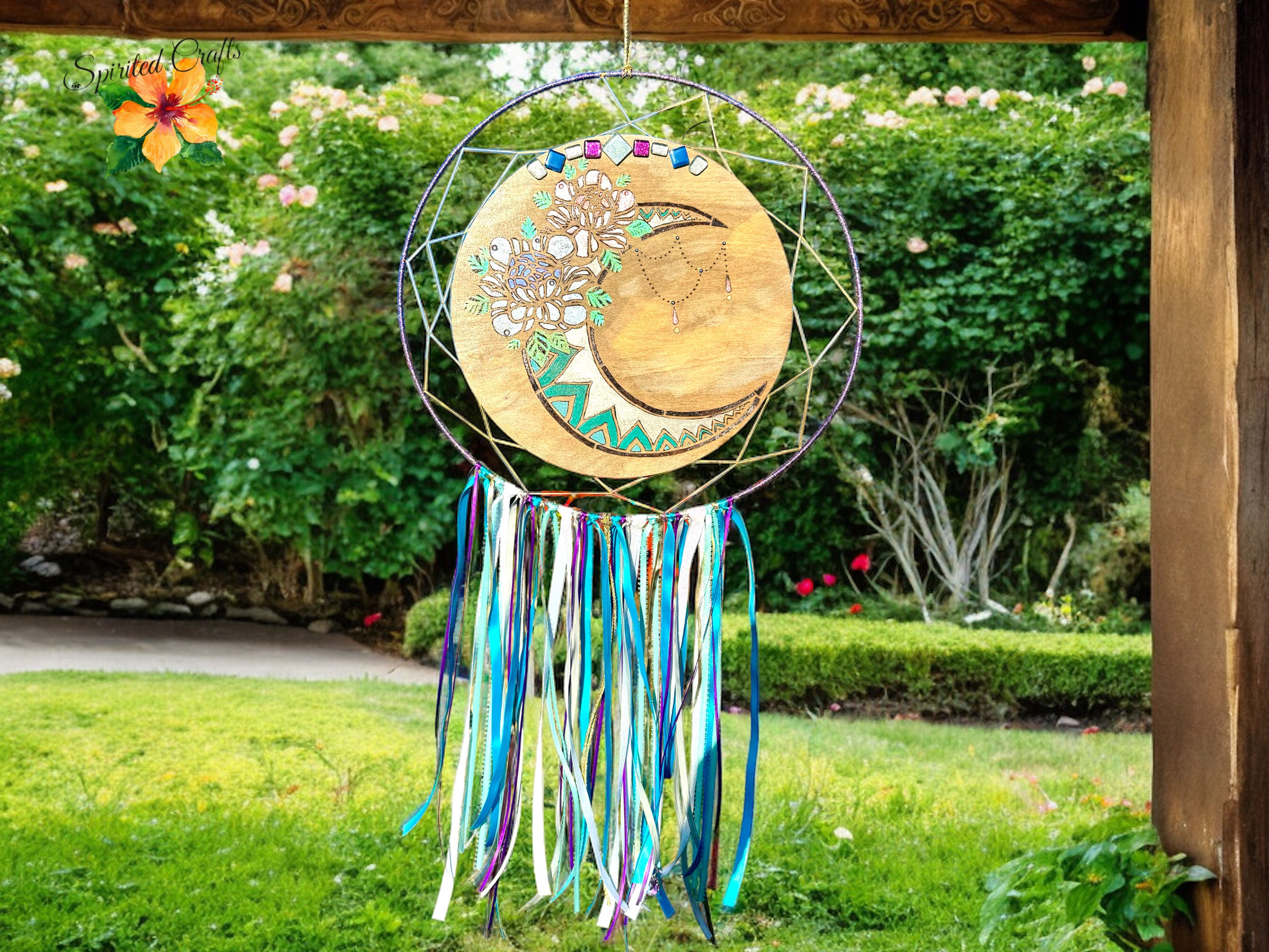 Moon dream catcher hanging on a porch