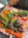 Italian sub with a side salad and dressing