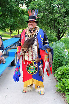 Native American teacher in full regalia