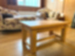 A photo of an oak coffee table