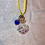 Thumbnail: Heart-shaped bottle necklace with colorful "bubble gum" and charm.