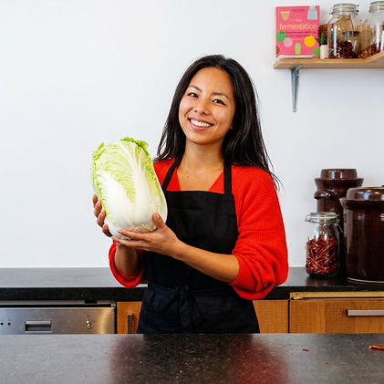 Romina holding a napa cabbage