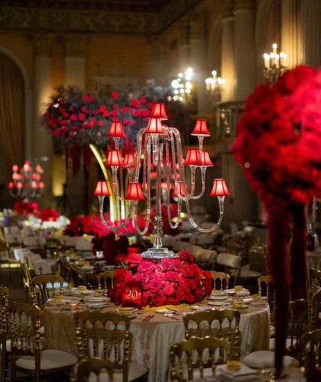 Elegant red floral centerpiece with candelabra