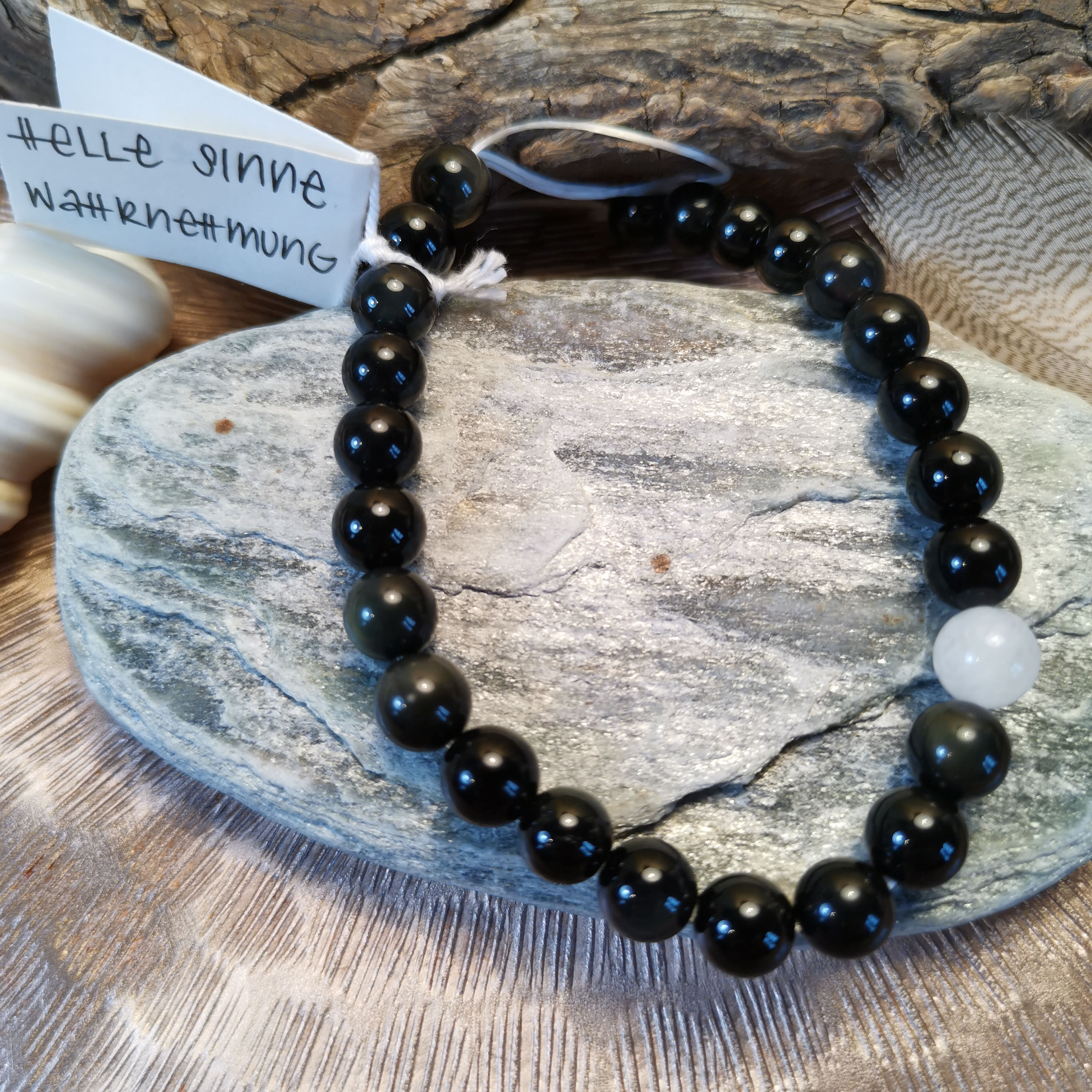 Regenbogenobsidian mit Schneekristall