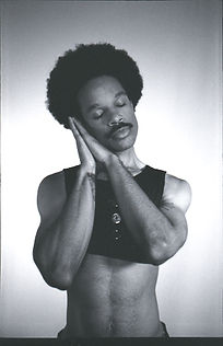 Model doing a sleep pose with hands gently placed on face