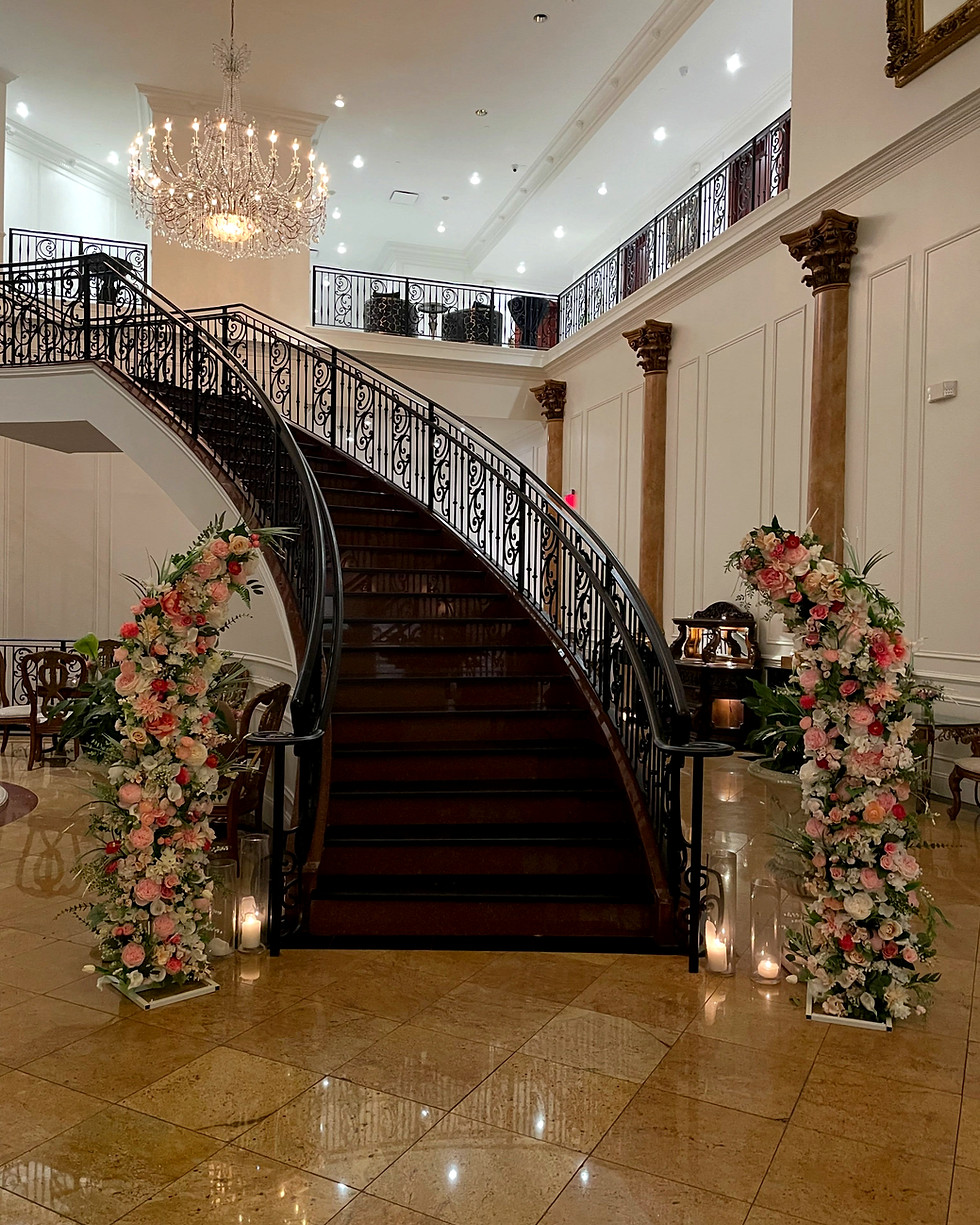 Floral wedding arch rental Lehigh Valley by grand stairs.
