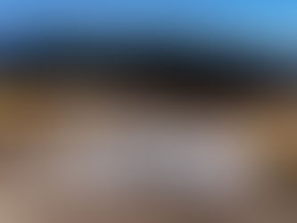 People ice skating at the U.S. National Whitewater Center’s outdoor winter rink at dusk; photo by Samuel Martin.