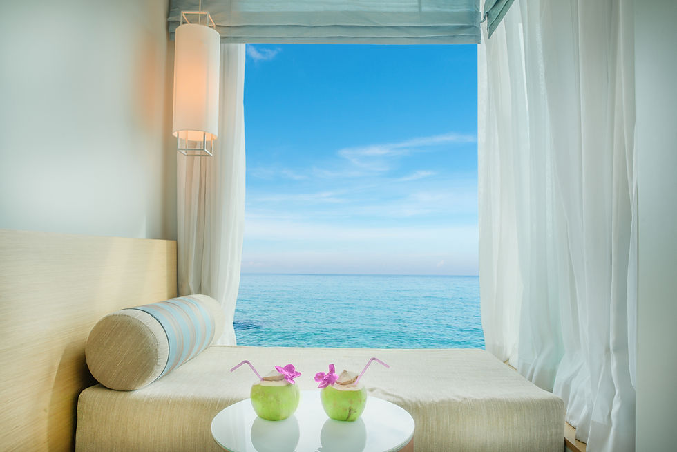 Summer, Travel, Vacation and Holiday concept - Beautiful tropical sea view at window in re
