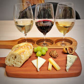 Wine and Cheese Pairing dish. A display of three wines paired with three cheeses and three accompaniments for lunch or dinner.