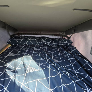 Pop-top bed with Duvalay sleep set up out