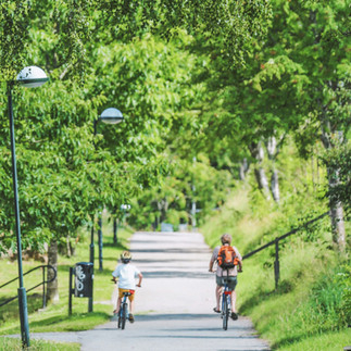 father and son riding bikes