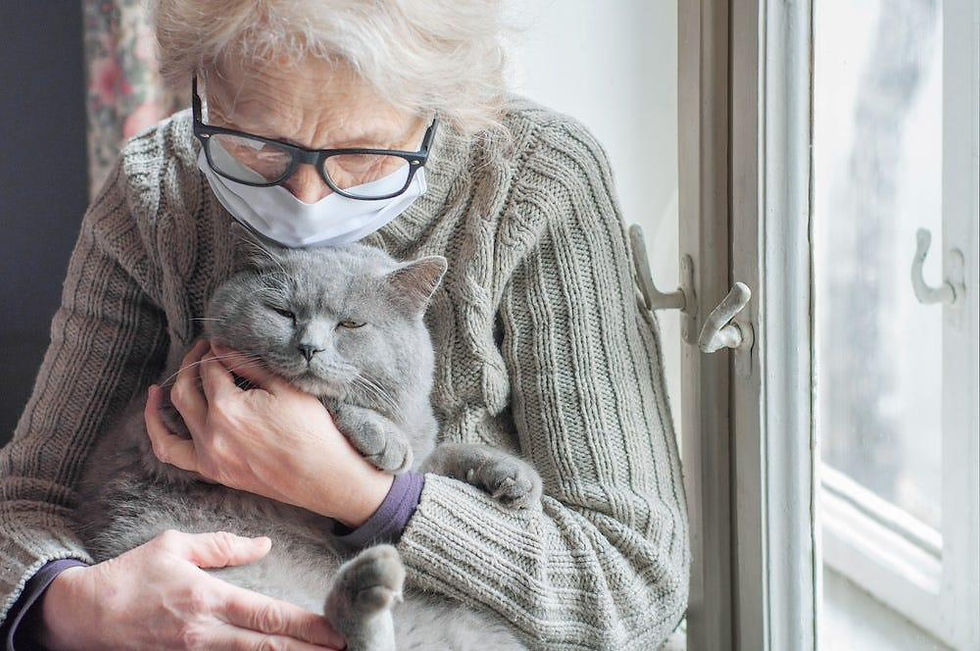 Older woman holding a cat