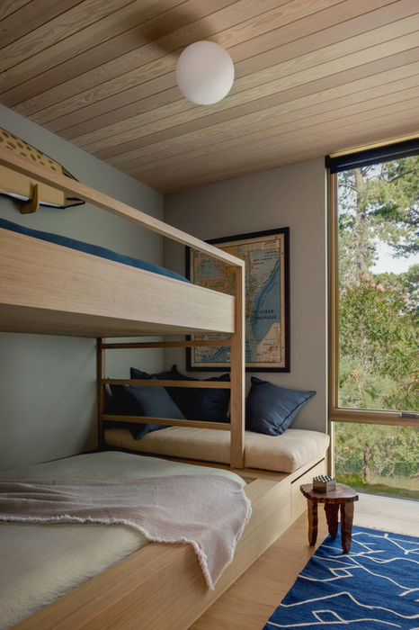 Hamptons Home Interior Design by Emily Lindberg Design. Guest / Kids Bedroom Custom Oak Bunk Bed. Pine Wood Clad Ceiling, Nautical Art, Full Height Window. Blend of Warm and Cool Natural Colors.