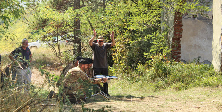 A UXO prior to having its fuze removed with an EOD tool.