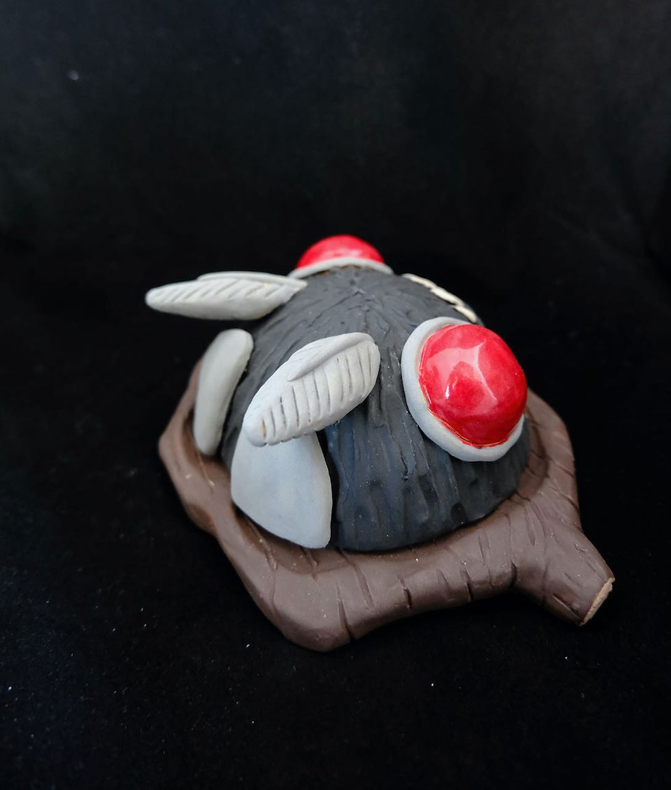 Thumbnail: Mothman on a log