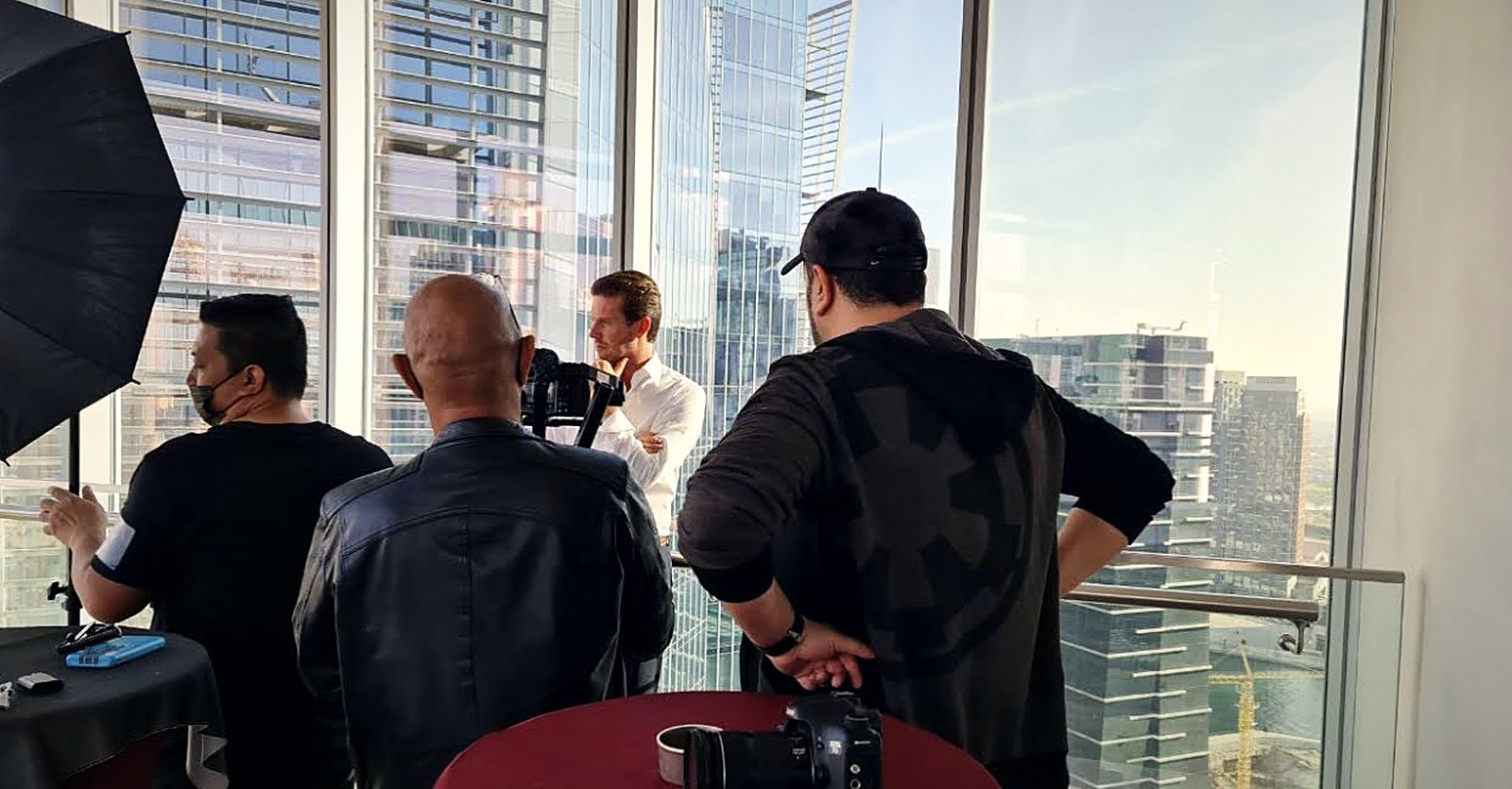Directing a talent shot by a high-rise window