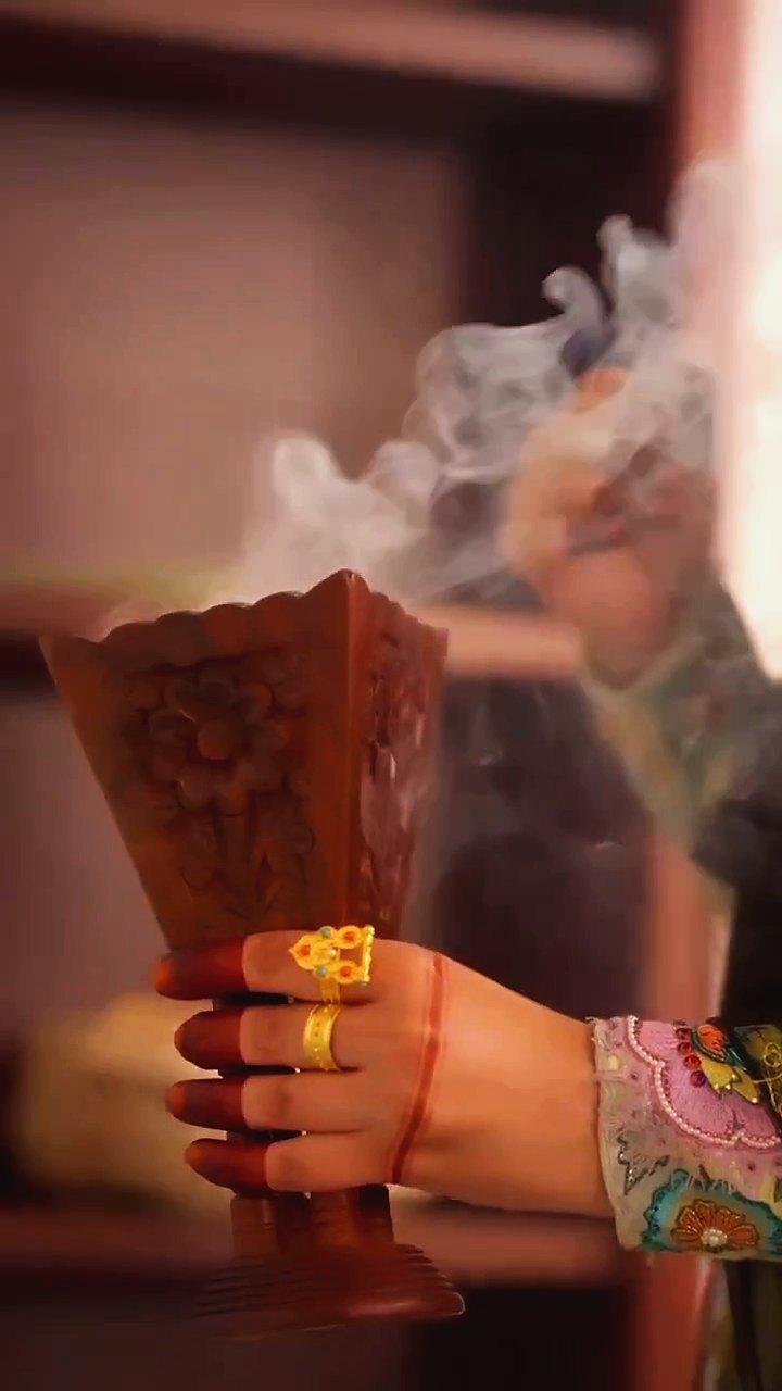 Close-up of traditional gold jewellery and henna