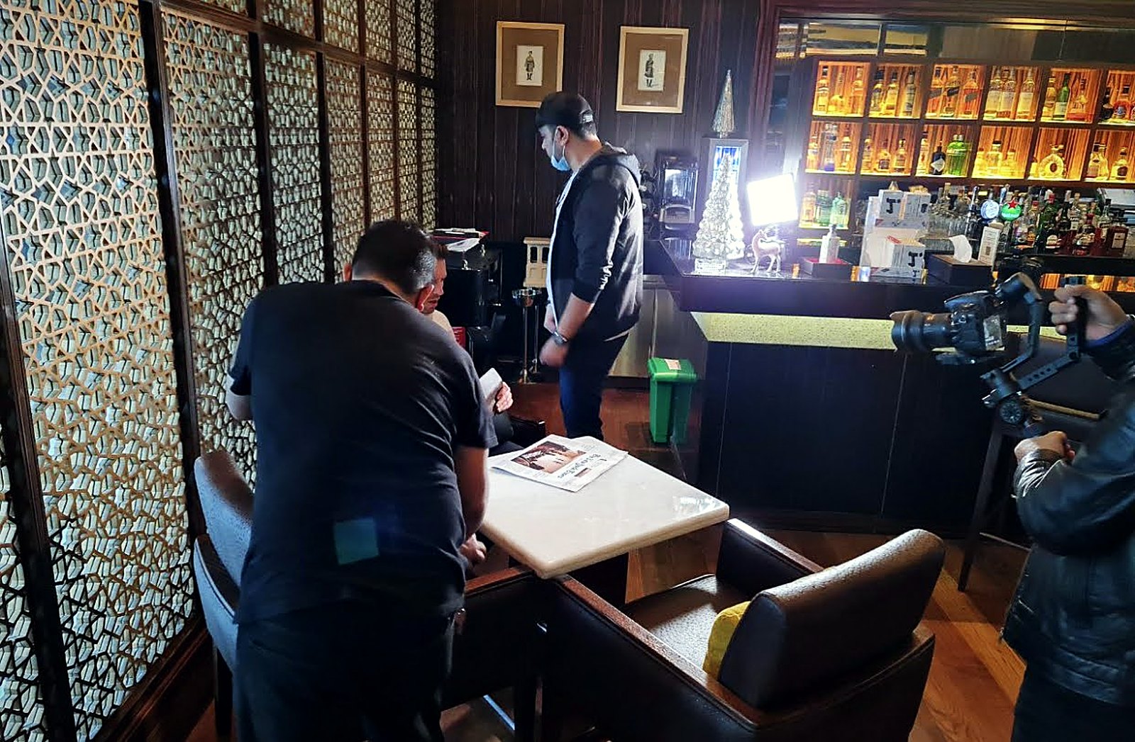 Setting up a scene in a hotel lounge