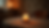 Eye-level view of a serene candlelit table with a single lit candle