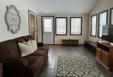 The Lake House includes a bright and spacious sunroom with views of Goose Lake.
