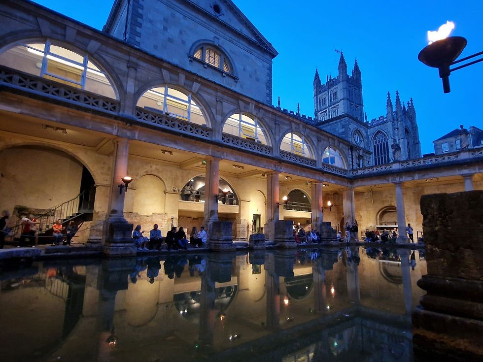 The Great Bath at the Roman Baths during a summer evening