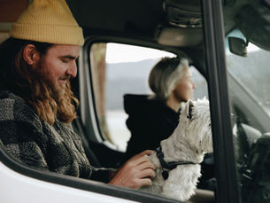 Dog riding along in truck cab with owner-operator